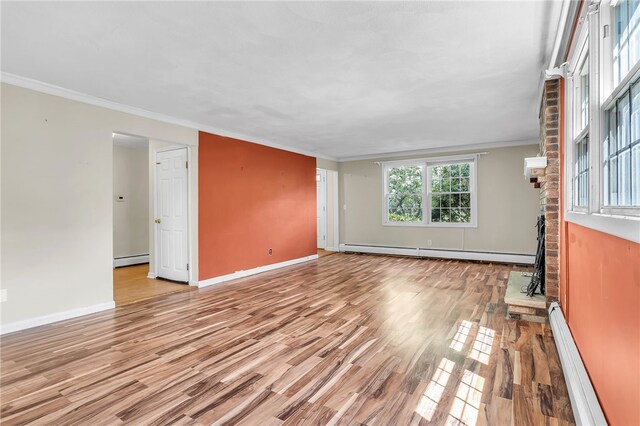 105 Quaker Dr, West Warwick, RI 02893 - unfurnished living room featuring crown molding, wood finished floors, and baseboard heating