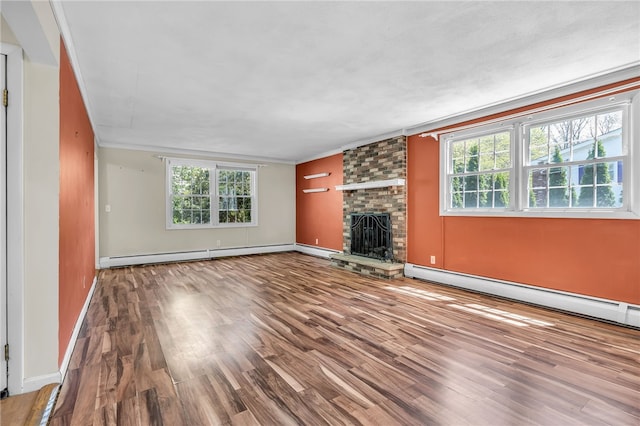 105 Quaker Dr, West Warwick, RI 02893 - unfurnished living room featuring ornamental molding, a brick fireplace, wood finished floors, and a baseboard heating unit