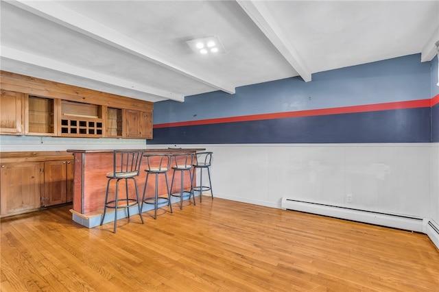 105 Quaker Dr, West Warwick, RI 02893 - bar with a baseboard radiator, light wood-style flooring, wainscoting, indoor bar, and beamed ceiling