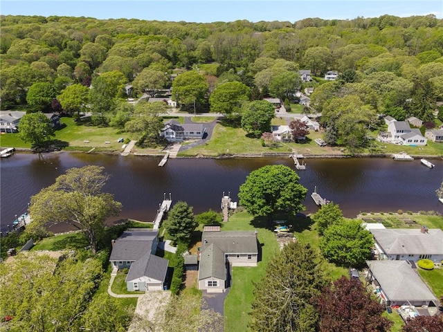 106 N River Dr, Narragansett, RI 02882 - aerial view of residential area with a nearby body of water and a heavily wooded area