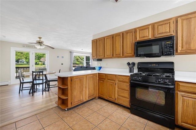 106 N River Dr, Narragansett, RI 02882 - kitchen with black appliances, light countertops, a ceiling fan, and a peninsula