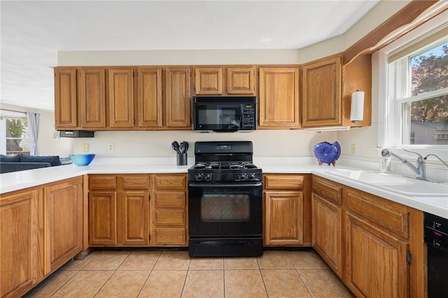 106 N River Dr, Narragansett, RI 02882 - kitchen featuring black appliances, a sink, and light countertops