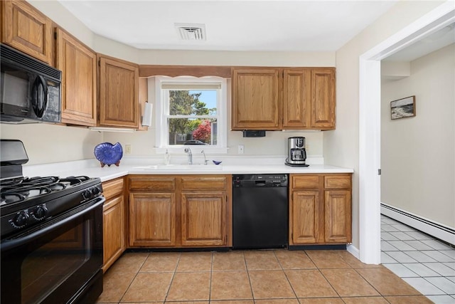 106 N River Dr, Narragansett, RI 02882 - kitchen featuring black appliances, a sink, light tile patterned flooring, and light countertops