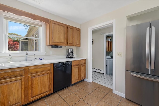 106 N River Dr, Narragansett, RI 02882 - kitchen with freestanding refrigerator, black dishwasher, baseboard heating, a sink, and light tile patterned floors