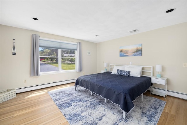 106 N River Dr, Narragansett, RI 02882 - bedroom featuring a baseboard radiator, wood finished floors, and recessed lighting