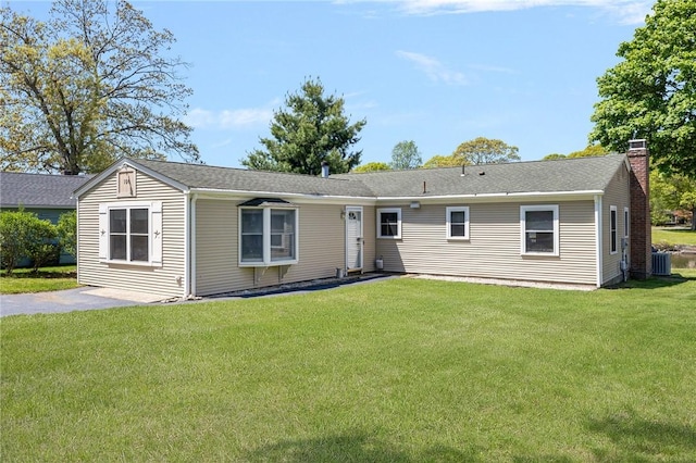 106 N River Dr, Narragansett, RI 02882 - single story home featuring a chimney, a front yard, and central AC unit