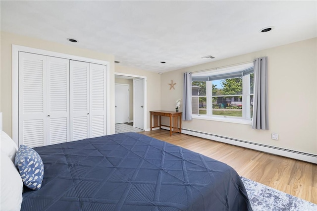 106 N River Dr, Narragansett, RI 02882 - bedroom with wood finished floors, a baseboard heating unit, a closet, recessed lighting, and baseboards