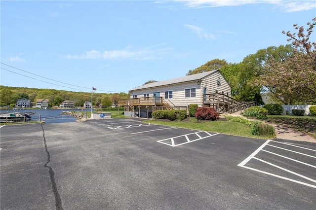 106 N River Dr, Narragansett, RI 02882 - uncovered parking lot featuring stairs