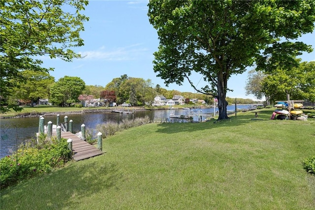 106 N River Dr, Narragansett, RI 02882 - dock featuring a water view and a lawn