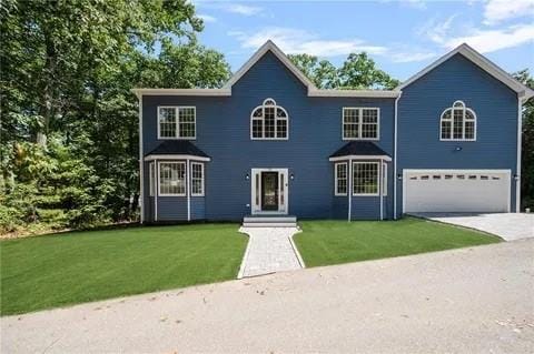 70 Shady Ln, Burrillville, RI 02859 - colonial-style house featuring a garage, a front yard, and driveway