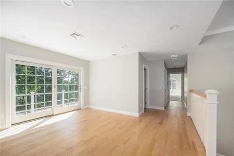70 Shady Ln, Burrillville, RI 02859 - spare room featuring light wood-type flooring and baseboards