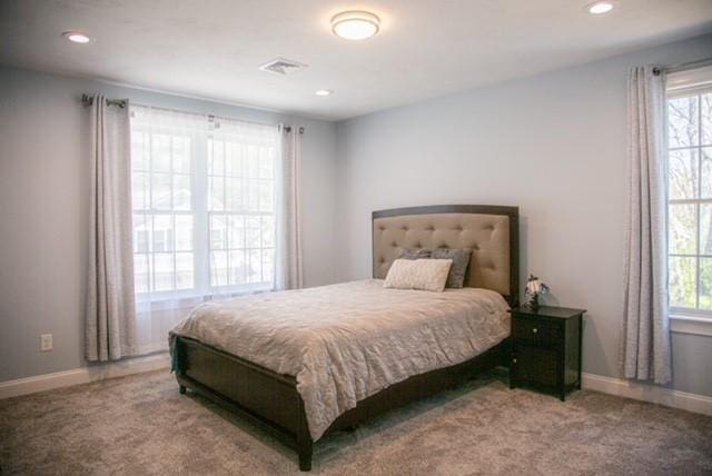 70 Shady Ln, Burrillville, RI 02859 - carpeted bedroom featuring multiple windows, recessed lighting, and baseboards