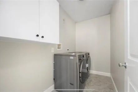 70 Shady Ln, Burrillville, RI 02859 - laundry area with washing machine and dryer, baseboards, and cabinet space