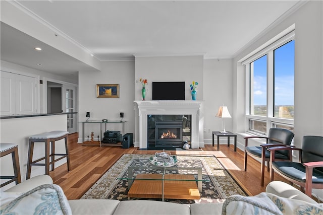 1 Tower Dr Unit 1502, Portsmouth, RI 02871 - living area with a tiled fireplace, ornamental molding, and wood finished floors