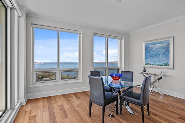 1 Tower Dr Unit 1502, Portsmouth, RI 02871 - dining room featuring a water view, ornamental molding, baseboards, and light wood-style flooring