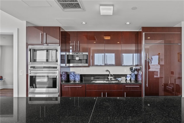 1 Tower Dr Unit 1502, Portsmouth, RI 02871 - kitchen featuring visible vents, modern cabinets, a sink, paneled built in refrigerator, and recessed lighting