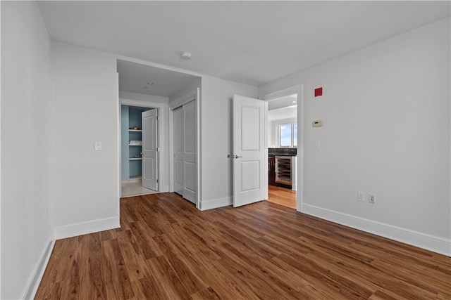 1 Tower Dr Unit 1502, Portsmouth, RI 02871 - spare room featuring wine cooler, baseboards, and dark wood-style floors