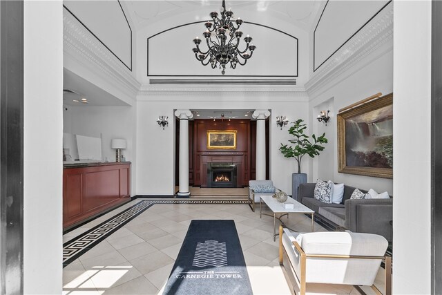 1 Tower Dr Unit 1502, Portsmouth, RI 02871 - interior space with light tile patterned floors, high vaulted ceiling, a lit fireplace, and a chandelier