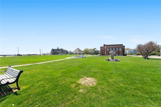 view of community featuring a lawn and a gazebo