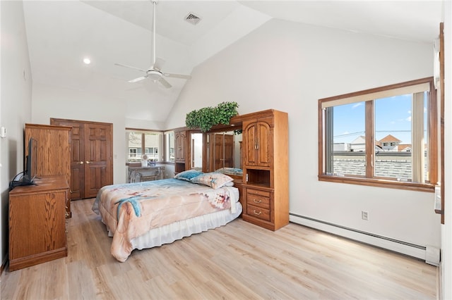 bedroom featuring high vaulted ceiling, a baseboard heating unit, multiple windows, and visible vents