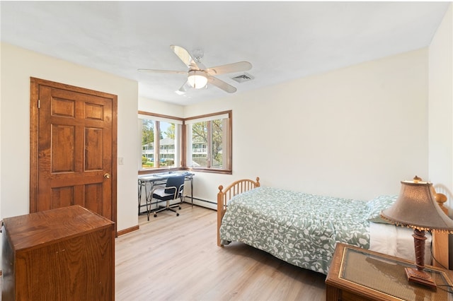 bedroom with visible vents, baseboards, ceiling fan, baseboard heating, and light wood finished floors