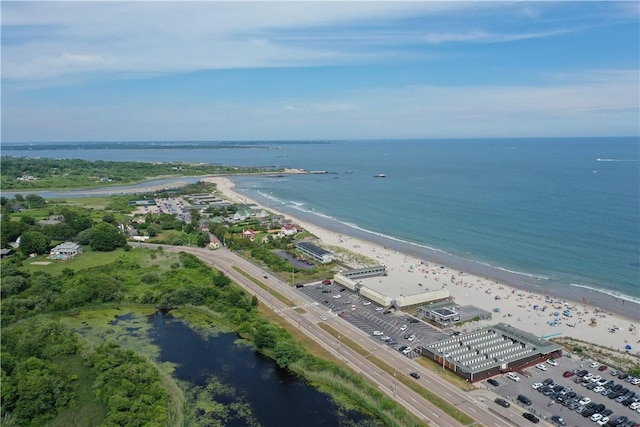 bird's eye view featuring a water view and a view of the beach