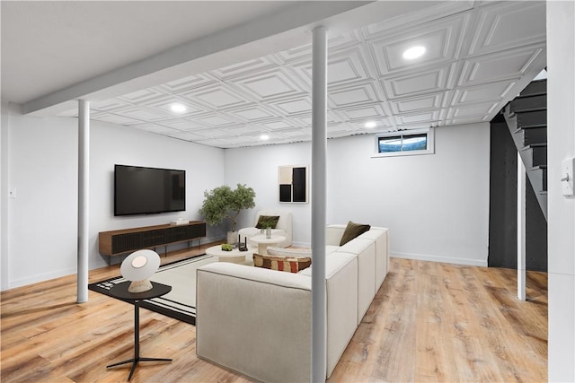 living area featuring an ornate ceiling, recessed lighting, and light wood-style flooring