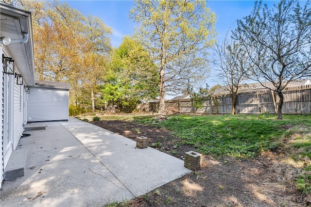 view of yard with a fenced backyard and a patio area