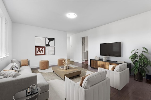 living area featuring baseboards and hardwood / wood-style flooring