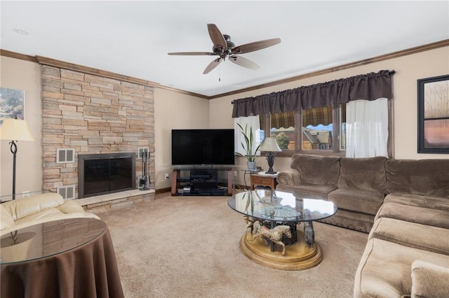 11 Renfrew Ave, Middletown, RI 02842 - living room featuring ornamental molding, a ceiling fan, carpet floors, and a stone fireplace