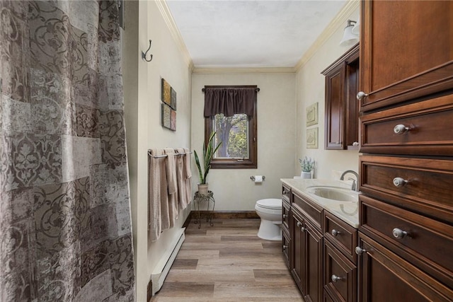 11 Renfrew Ave, Middletown, RI 02842 - full bath featuring baseboard heating, crown molding, toilet, vanity, and wood finished floors