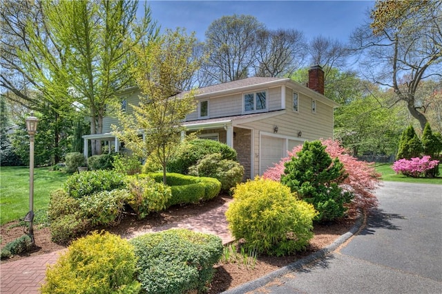 23 Pine Top Rd, Barrington, RI 02806 - view of front of home featuring an attached garage and a chimney