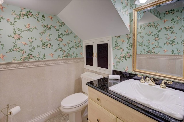 23 Pine Top Rd, Barrington, RI 02806 - half bathroom featuring wallpapered walls, vaulted ceiling, wainscoting, vanity, and tile patterned floors