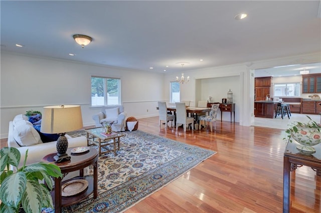 23 Pine Top Rd, Barrington, RI 02806 - living area featuring a chandelier, light wood finished floors, crown molding, and recessed lighting