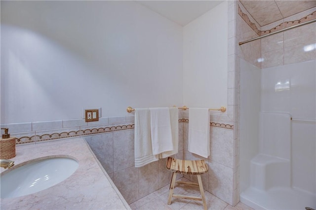 23 Pine Top Rd, Barrington, RI 02806 - full bath with a shower, tile walls, vanity, and tile patterned floors