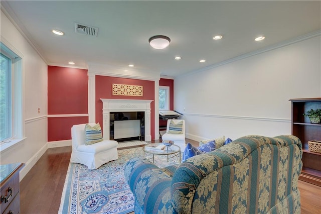 23 Pine Top Rd, Barrington, RI 02806 - living area with ornamental molding, a fireplace, wood finished floors, and recessed lighting