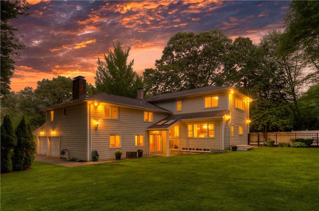 23 Pine Top Rd, Barrington, RI 02806 - back of property at dusk featuring a chimney