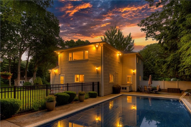 23 Pine Top Rd, Barrington, RI 02806 - back of property at dusk featuring a patio