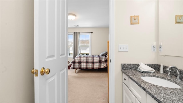 bathroom with vanity and visible vents