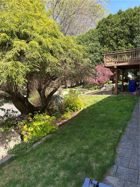view of yard with a wooden deck