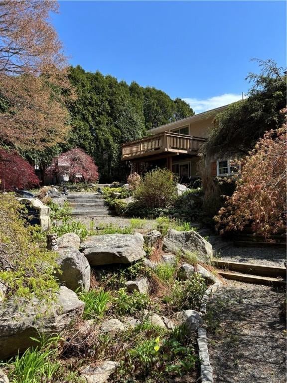 view of yard featuring a wooden deck