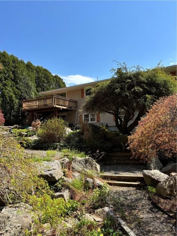 back of property with a wooden deck