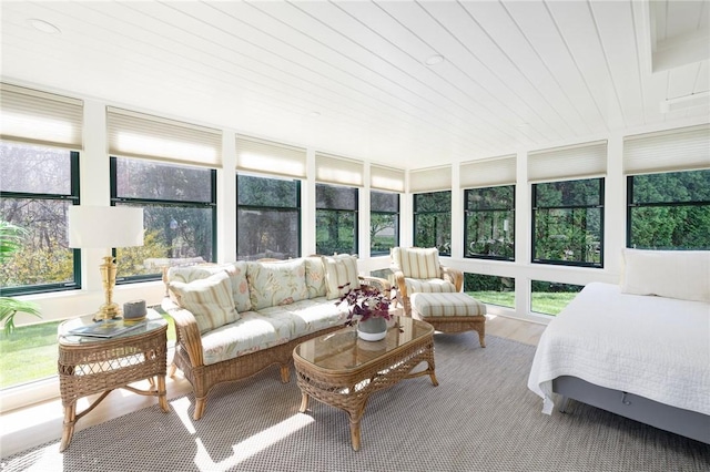 sunroom with wood ceiling and wood finished floors