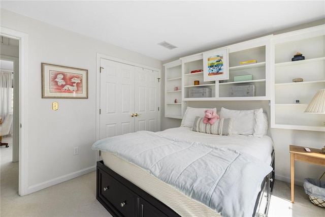 bedroom with baseboards, light carpet, a closet, and visible vents