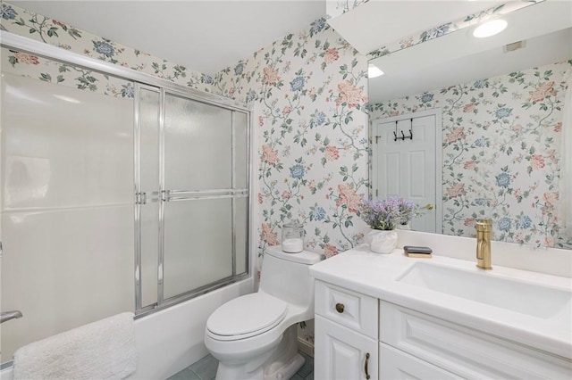 full bathroom featuring toilet, wallpapered walls, enclosed tub / shower combo, and vanity