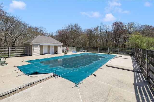 pool with fence and a patio