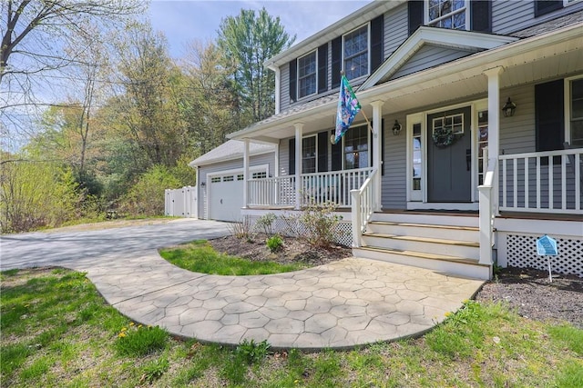 545 Central St, Burrillville, RI 02839 - entrance to property featuring covered porch, asphalt driveway, and an attached garage