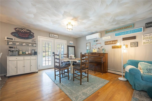 545 Central St, Burrillville, RI 02839 - dining room with a wall mounted AC, a baseboard heating unit, french doors, light wood finished floors, and a bar