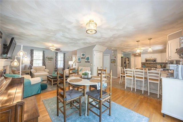 545 Central St, Burrillville, RI 02839 - dining room with ceiling fan and light wood-style floors