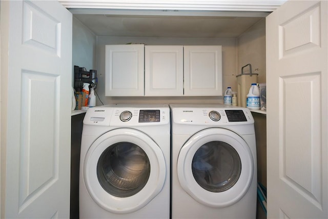 545 Central St, Burrillville, RI 02839 - laundry room featuring washing machine and clothes dryer and cabinet space